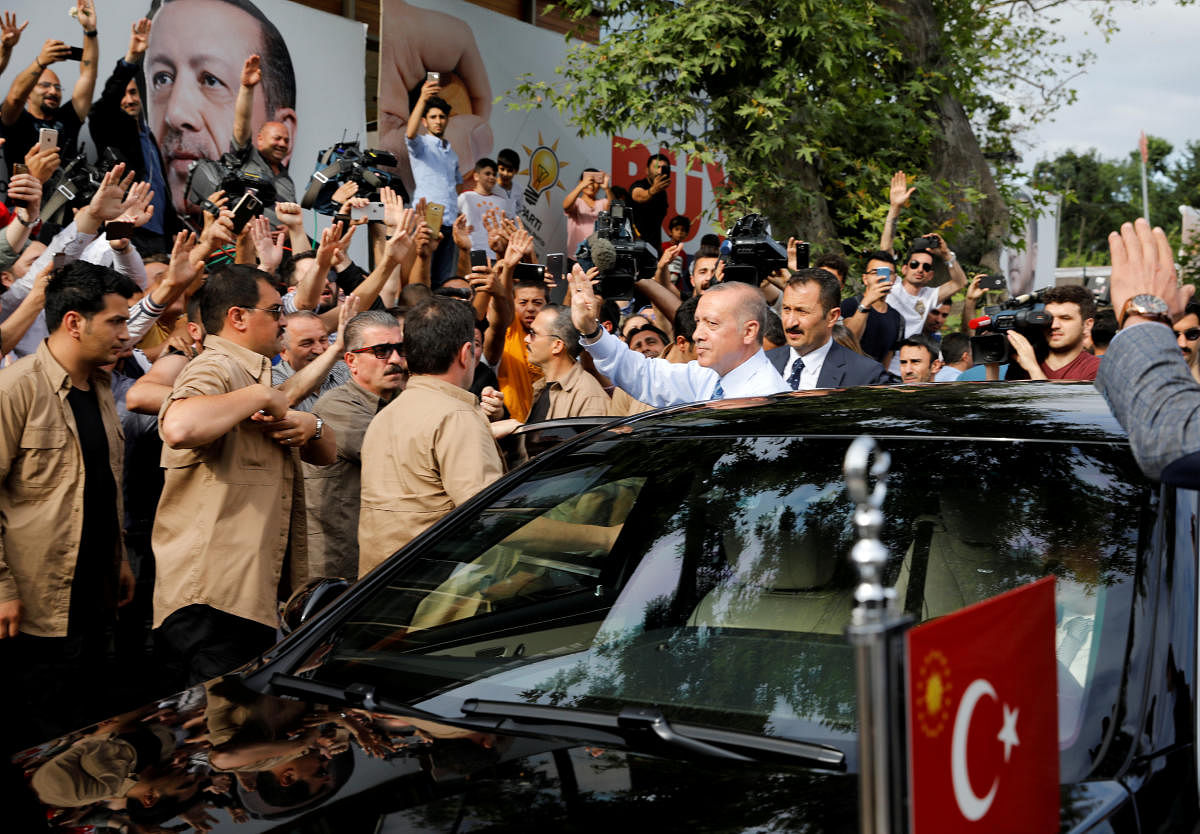 Turkish President Tayyip Erdogan waves to supporters as he leaves his residence in Istanbul. Reuters photo.