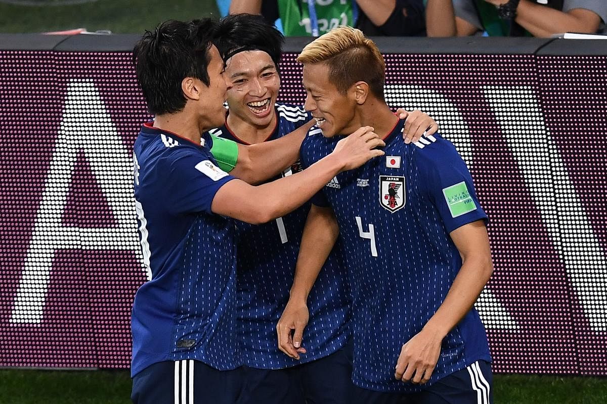UNITED THEY DELIVER: Japan have played some adventurous football at this World to stand on the verge of entering the last-16 phase. AFP