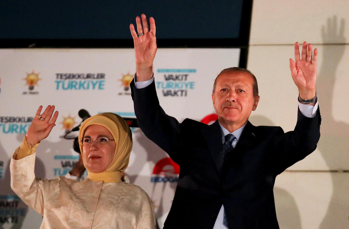 Turkish President Tayyip Erdogan and his wife Emine Erdogan greet supporters gathered in front of the AKP headquarters in Ankara, Turkey. REUTERS Photo