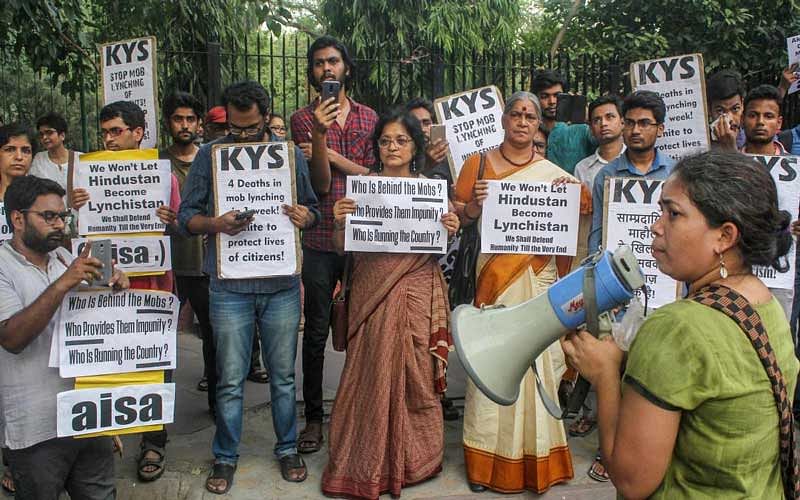 Family members of Md Kasim (45) who was lynched in Hapur allegedly over cow slaughter, with members of KYS and AISA stage a protest, at parliament street in New Delhi. (PTI Photo)