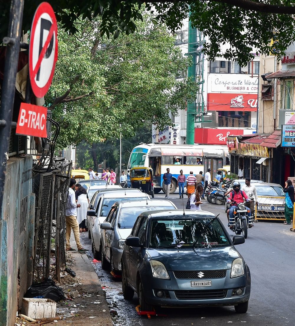 The proposal aims to declutter busy roads like Residency Road (above), lined with parked cars.