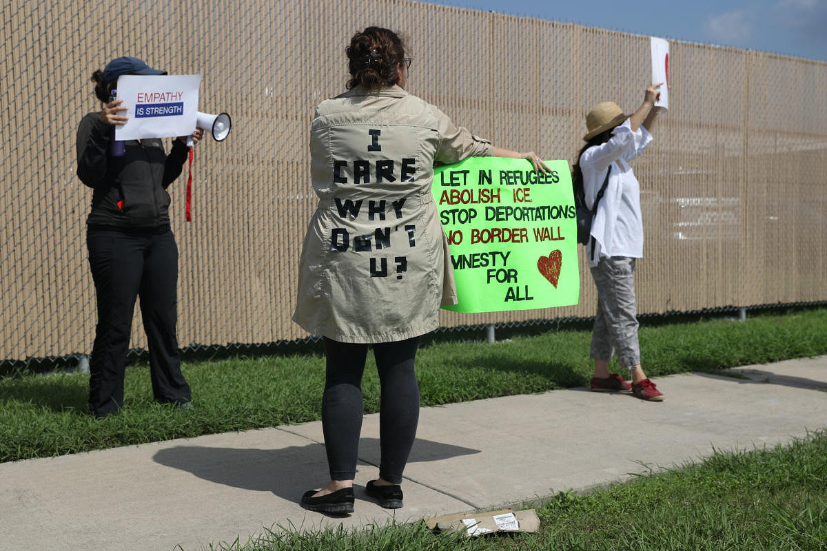 A woman protesting the detainment of undocumented immigrant children wears a jacket referencing Melania Trump during a demonstration outside a US Border Patrol processing center in McAllen, Texas. REUTERS Photo