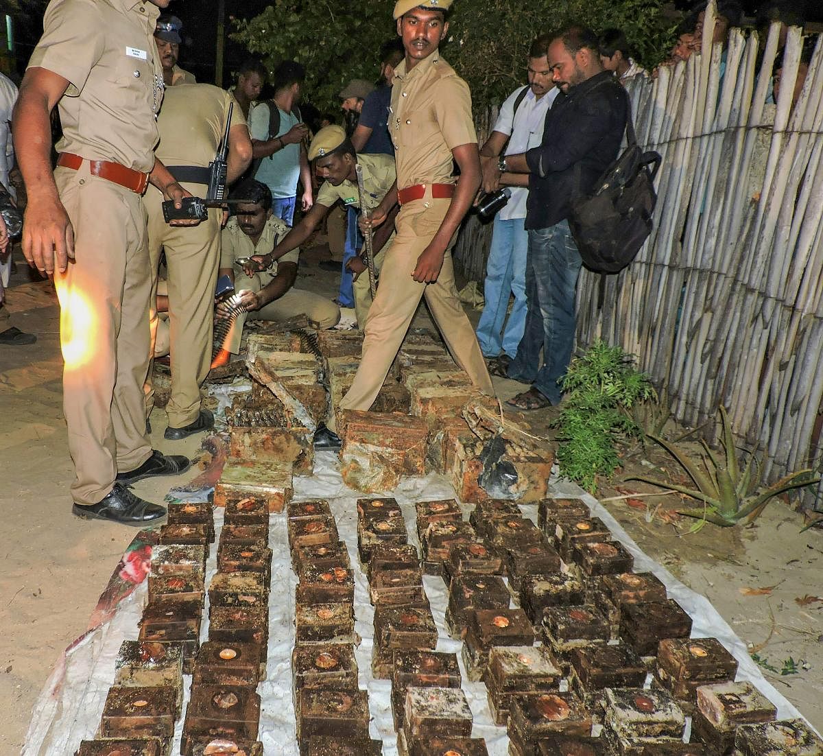 Police display the huge consignment of ammunition and explosives recovered near Thangachimadam, in Rameswaram on Monday evening. PTI