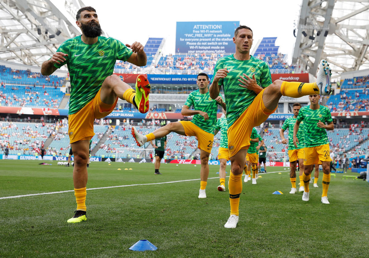 Australia's Mile Jedinak and Mark Milligan during the warm-up before the match REUTERS