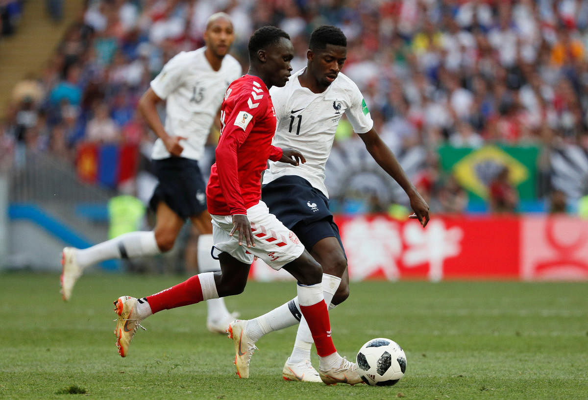 Denmark's Pione Sisto in action with France's Ousmane Dembele REUTERS