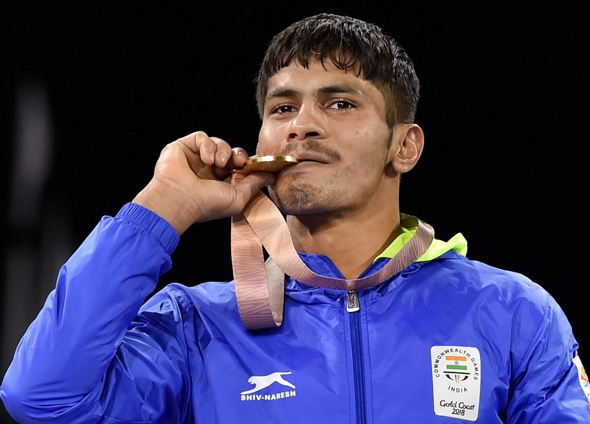 Gold medalist India's Rahul Aware during the medal ceremony of men's freestyle 57kg wrestling final at the Commonwealth Games 2018 in Gold Coast. (PTI Photo)