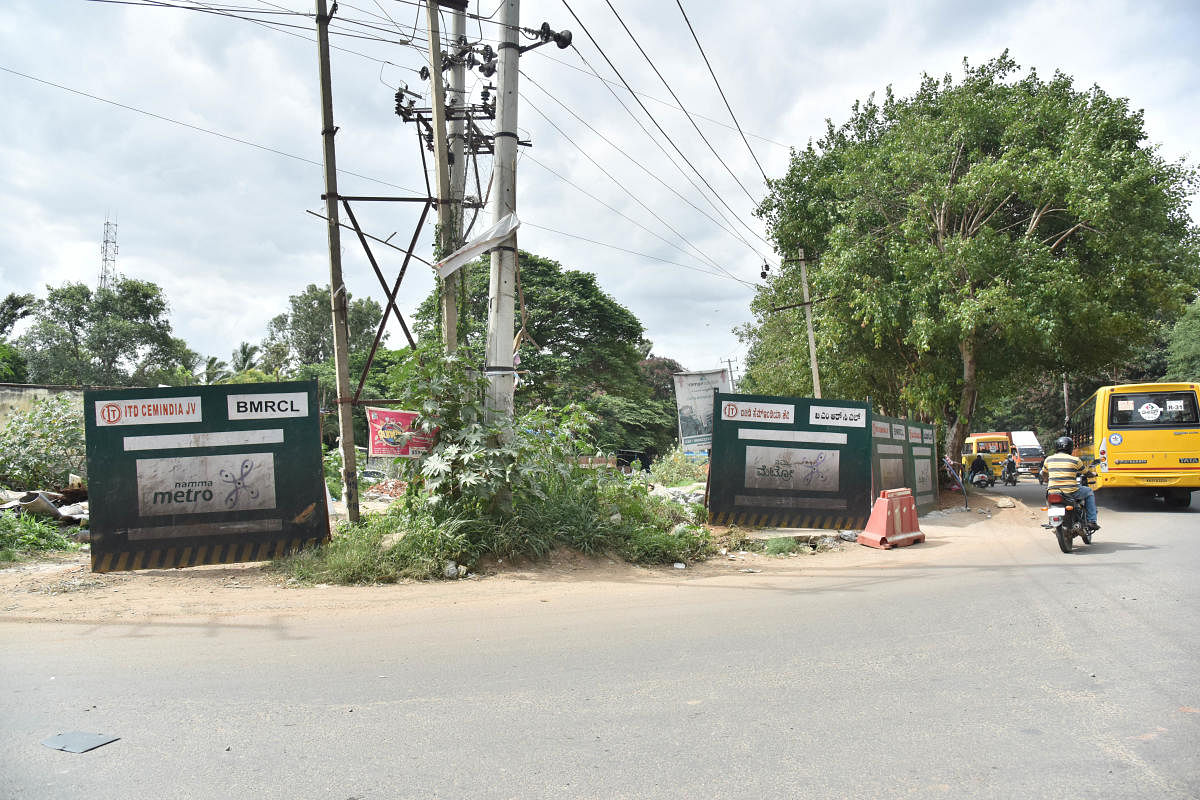 Land barricaded by BMRCL for its Metro corridor in Kadugodi. DH photo/Janardhan B K