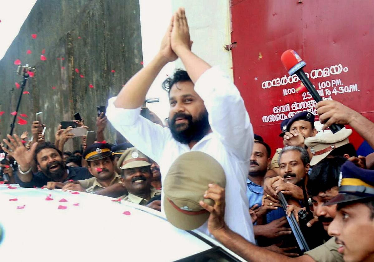 Actor Dileep being welcomed by a cheering crowd comprising his fans and friends as he comes out of Aluva sub-jail, in Kochi. (PTI Photo)