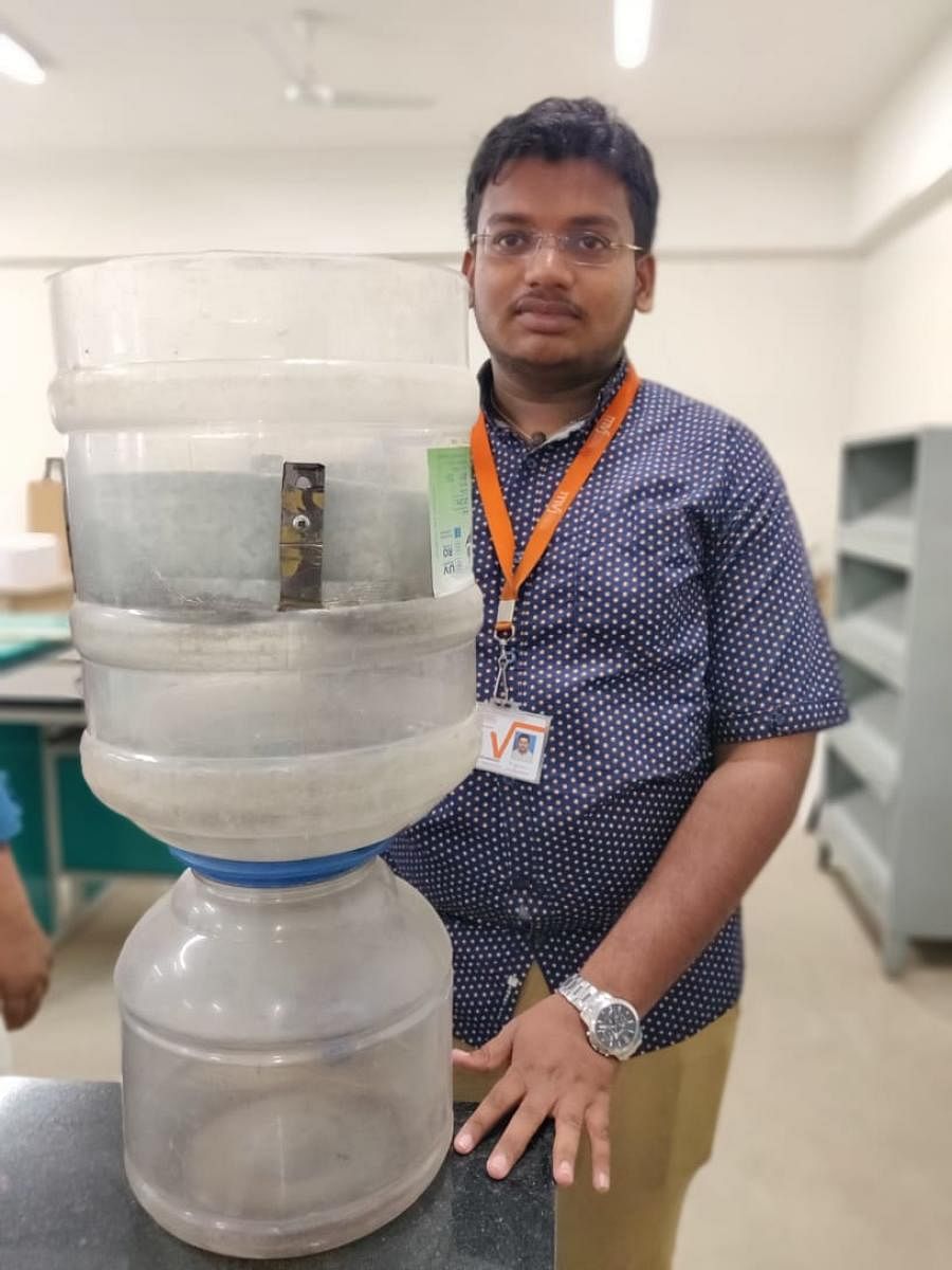 Pavan A demonstrates his model to purify Bellandur water. 