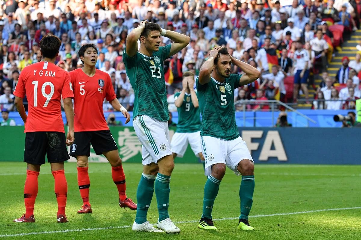 Germany's forward Mario Gomez (L) and Germany's defender Mats Hummels react after failing to score during the Russia 2018 World Cup Group F football match between South Korea and Germany at the Kazan Arena in Kazan. AFP