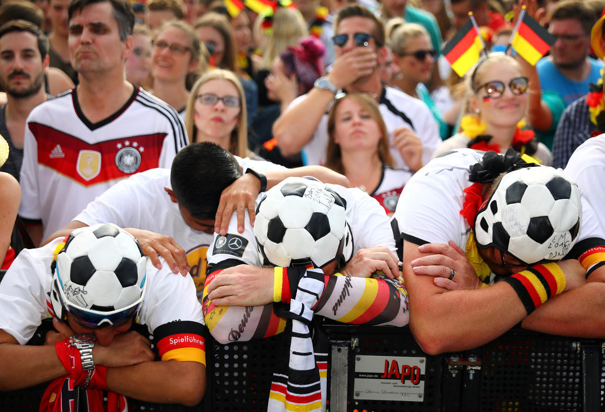 Germany fans react as they watch the match against South Korea at a public viewing area at Brandenburg Gate in Berlin. (Reuters Photo)