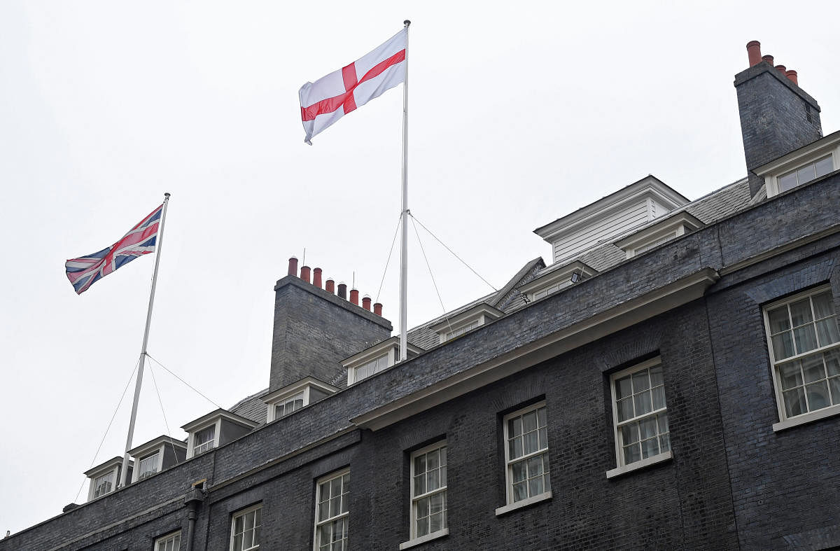 The St George's Flag flies above 10 Downing Street, ahead of England's game against Belgium in the World Cup on Thursday, in Westminster, London. (Reuters)