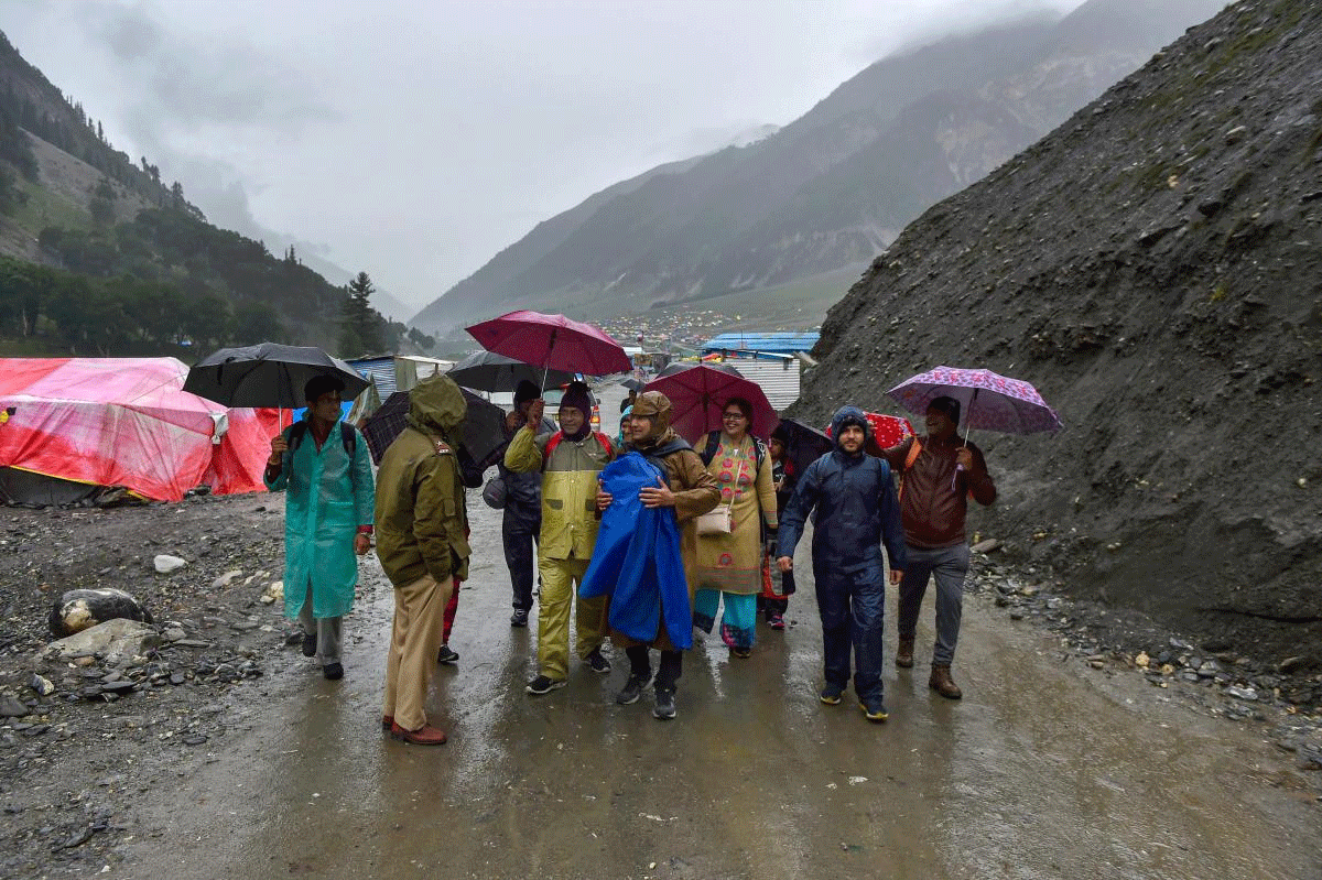 First batch of Amarnath pilgrims arrive at the base camp at Baltal, in Ganderbal district of central Kashmir on Thursday, June 28, 2018. The annual two-month Amarnath Yatra to commence on Thursday was halted dur to bad weather and heavy rainfall. PTI Photo