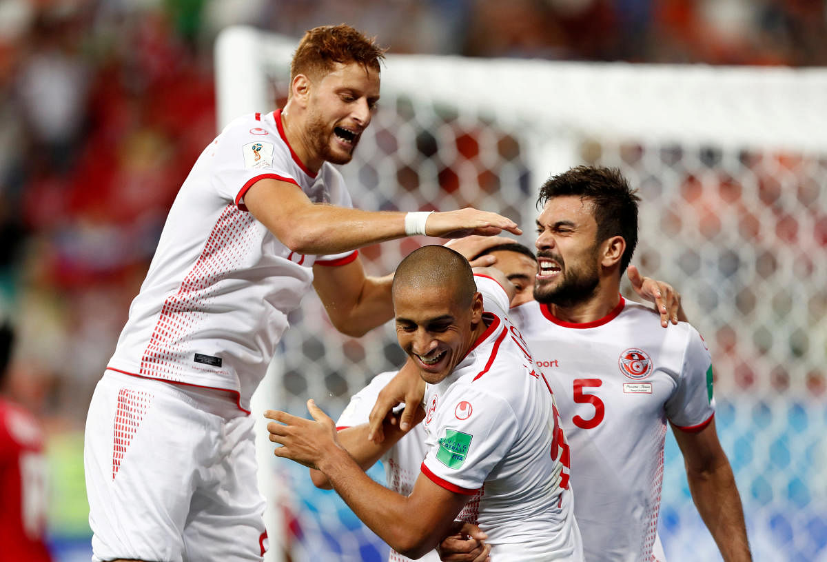 MEMORABLE MOMENT: Tunisia's Wahbi Khazri (centre) is mobbed by his team-mates after scoring the winner against Panama on Thursday. REUTERS