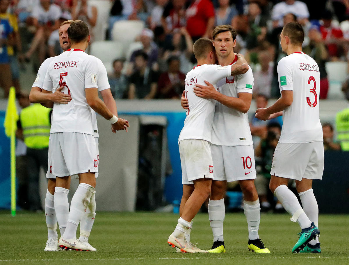  Poland's Grzegorz Krychowiak and Jacek Goralski celebrate victory after the match. Reuters photo