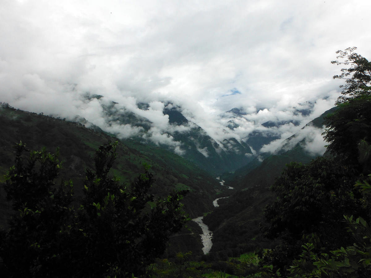 Clouds start to fill the valleys in the lower Annapurna Himalayas during monsoon.