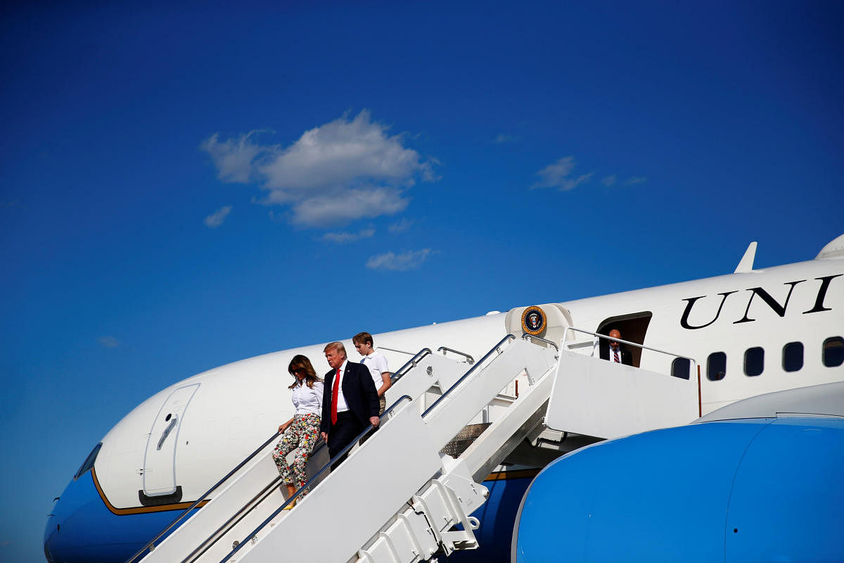 U.S. President Donald Trump, First Lady Melania Trump and their son Barron disembark Air Force One in Morristown, New Jersey, from Joint Base Andrews, Maryland, U.S., June 29, 2018. Reuters. 