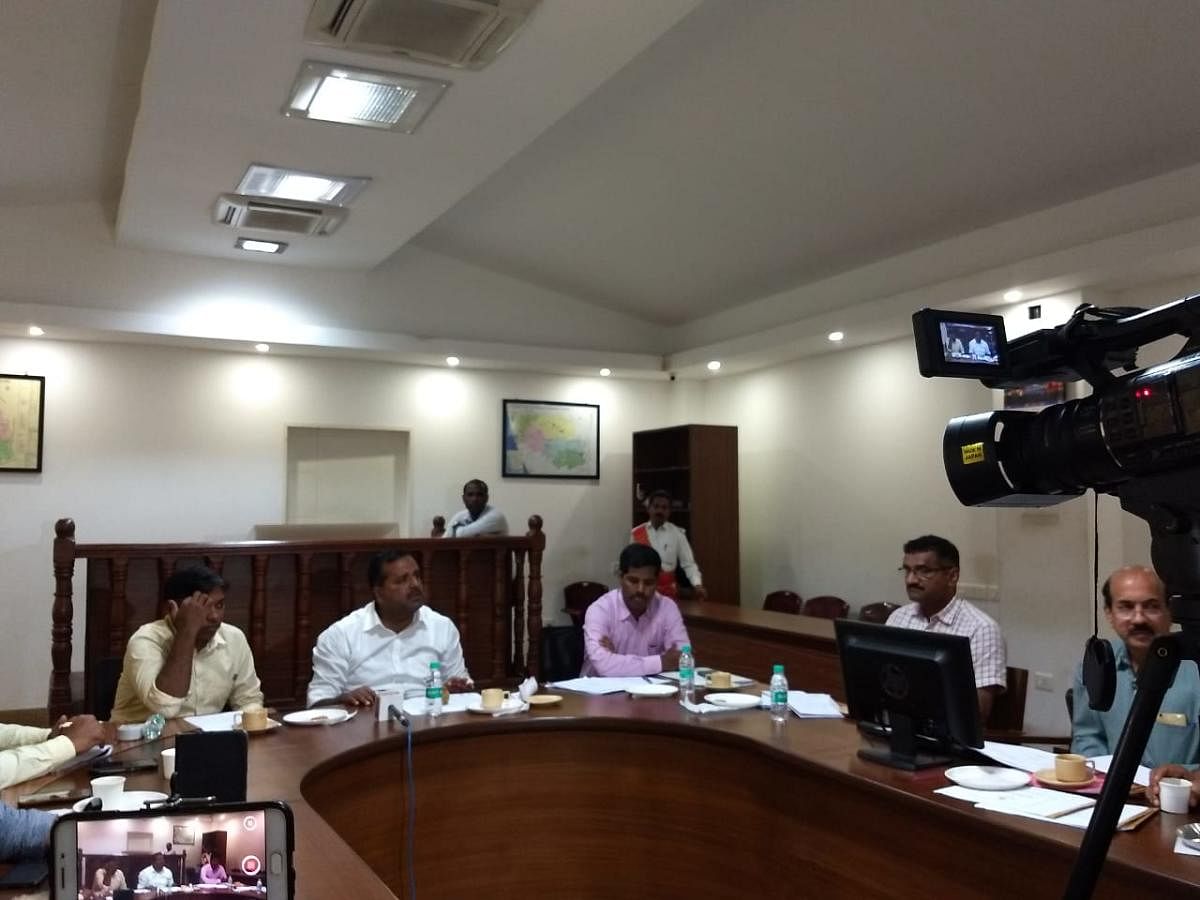 Urban Development and Housing Minister U T Khader chairs meeting at Mangaluru deputy commissioner's office to review progress of national highways on Saturday. DH Photo