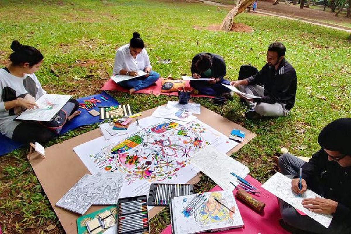 Participants immersed in colouring at the Sunday Colouring session in Cubbon Park.