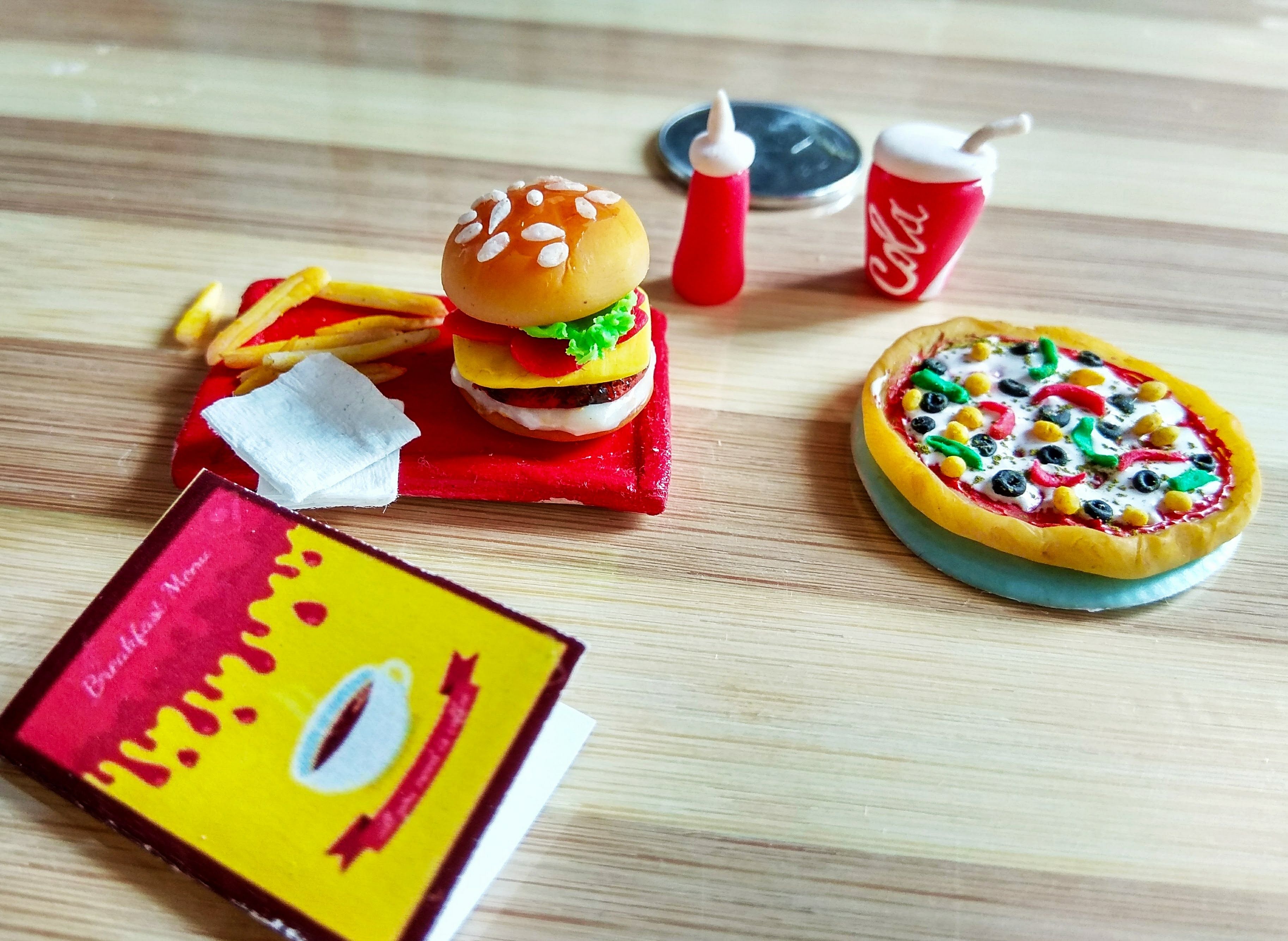Umagayathri makes miniature food models of popular dishes out of air-dry clay.
