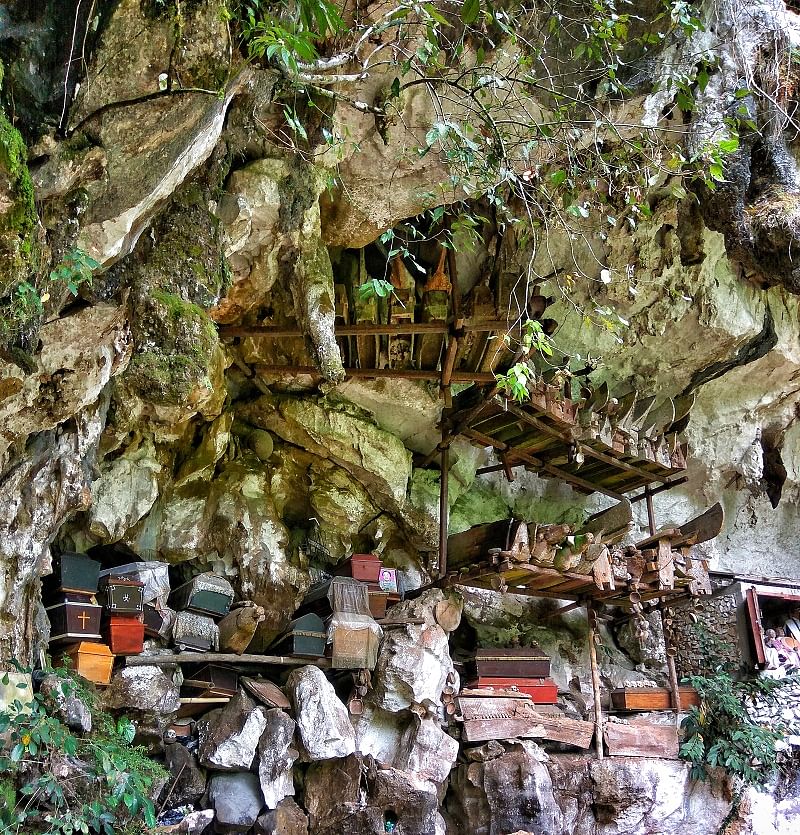  A cave face studded with coffins and corpses