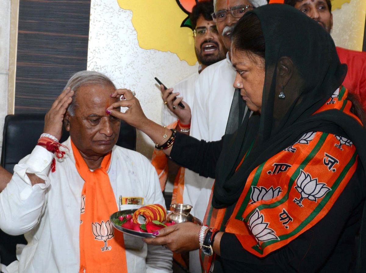 Madan Lal Saini with Vasundhara Raje