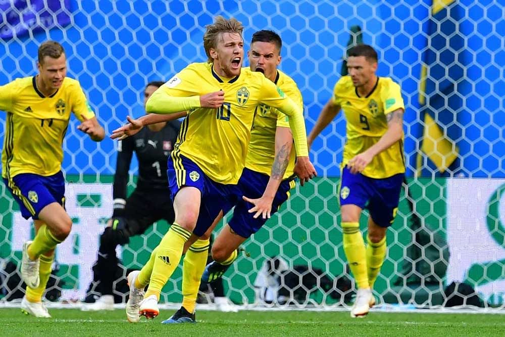 Sweden's midfielder Emil Forsberg (2nd L) celebrates scoring during the Russia 2018 World Cup round of 16 football match between Sweden and Switzerland at the Saint Petersburg Stadium in Saint Petersburg. AFP PHOTO