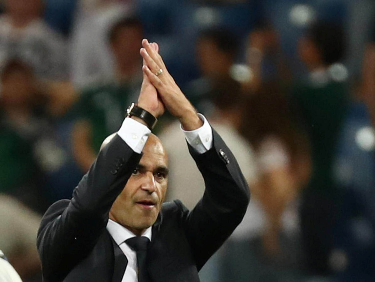 Belgium coach Roberto Martinez applauds fans after the match. Reuters photo