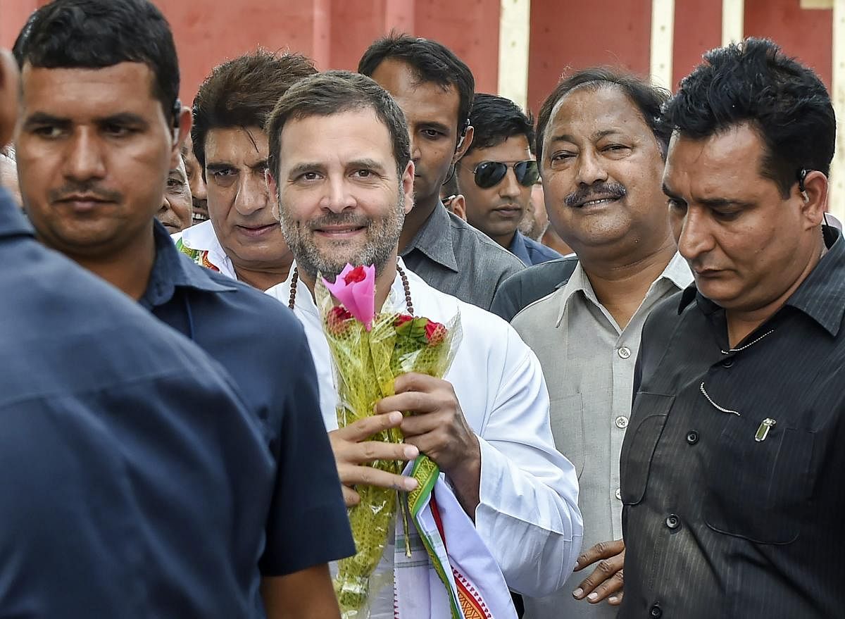Congress President Rahul Gandhi meets party workers at Chowdhury Charan Singh airport before leaving for Amethi constituency, in Lucknow. (PTI Photo)