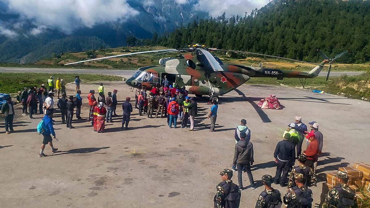 Indian pilgrims being evacuated from Simikot to Surkhet and Nepalganj, as authorities stepped up efforts to rescue those stranded there due to heavy rain while returning from the Kailash Mansarovar pilgrimage in Tibet in Simikot. (PTI Photo)