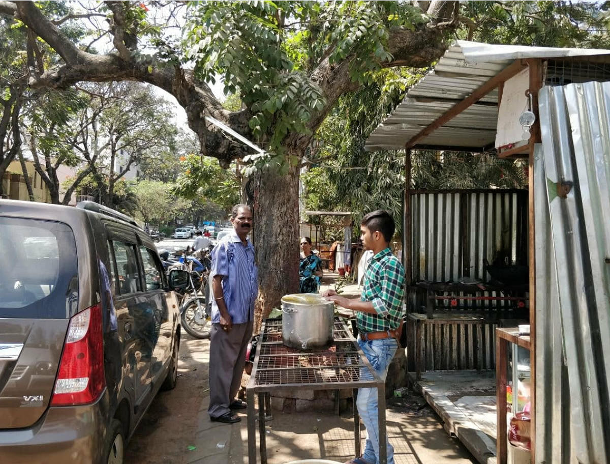 Shops occupying the footpath in Defence Colony on Sundays.