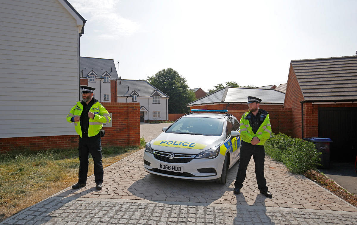 Police officers guard the entrance to a housing estate on Muggleton Road, after it was confirmed that two people had been poisoned with the nerve-agent Novichok, in Amesbury, Britain. (Reuters Photo)