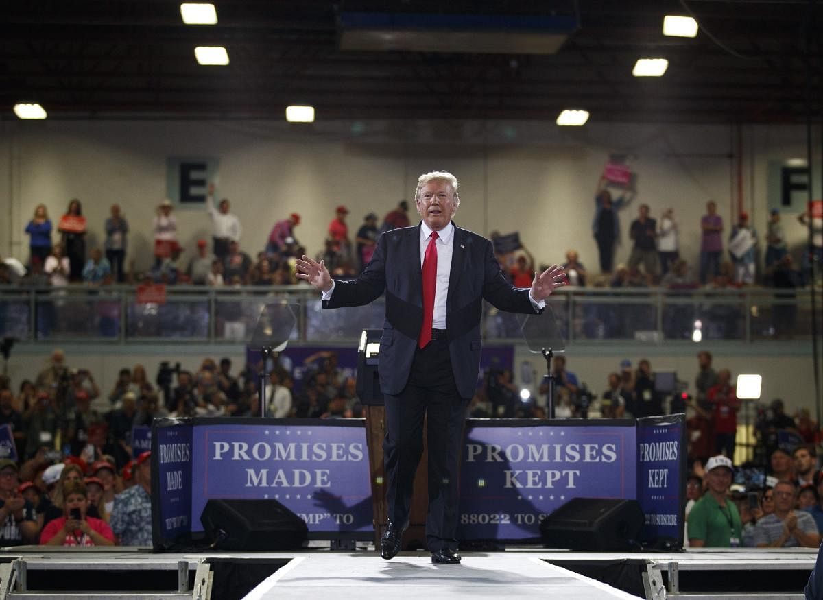 President Donald Trump reacts to the cheering crowd as he leaves a rally at the Four Seasons Arena at Montana ExpoPark, Thursday, in Great Falls, Mont.AP/PTI Photo