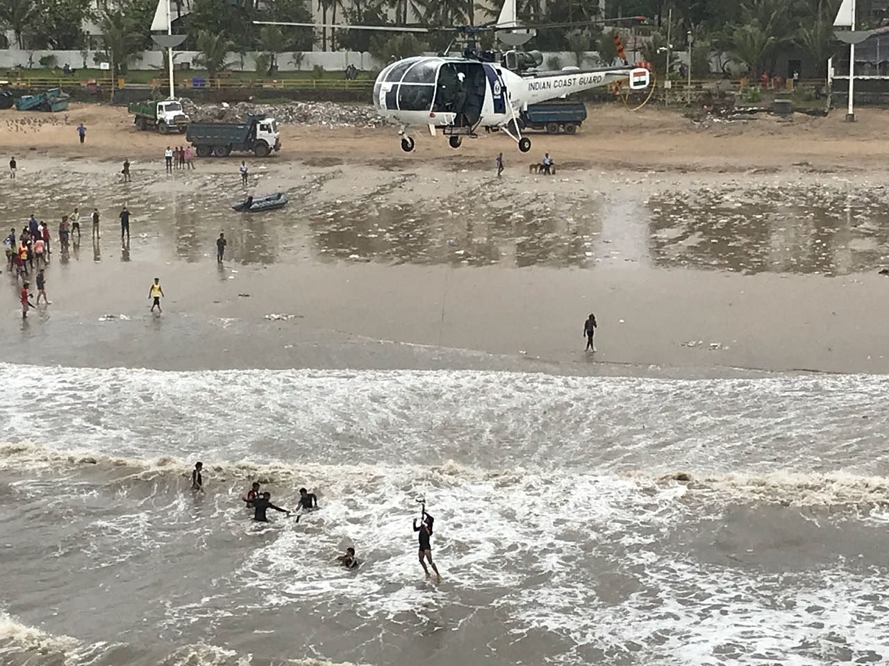A Coast Guard helicopter undertaking search and rescue operation for the four persons off Juhu beach.