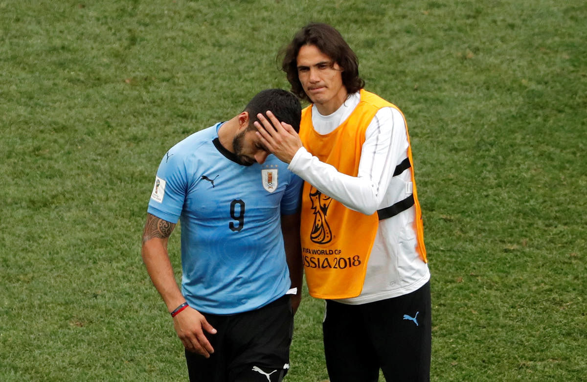 Uruguay's Luis Suarez and Edinson Cavani look dejected after their World Cup quarter-final against France. (Reuters Photo)
