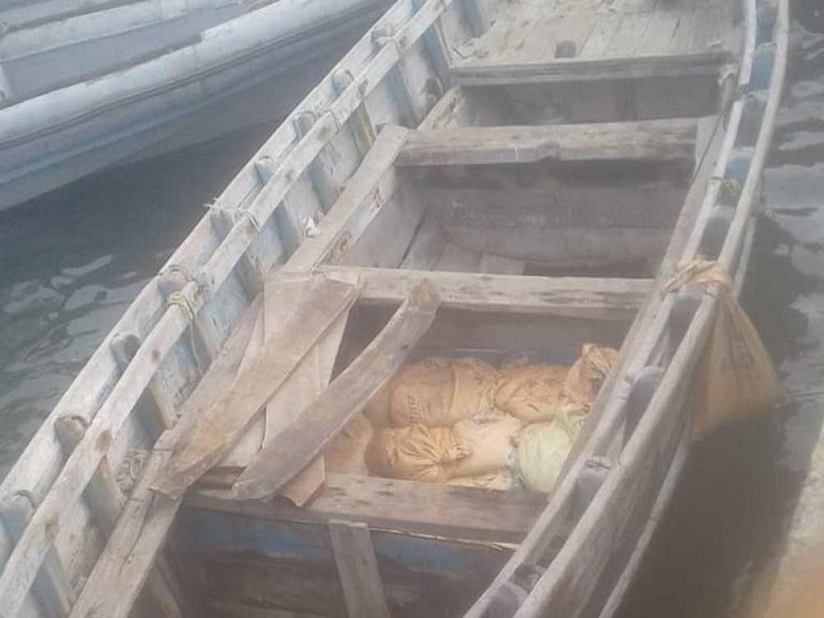 A boat used to smuggle the sea cucumber has also been seized. (Image courtesy ANI/Twitter)