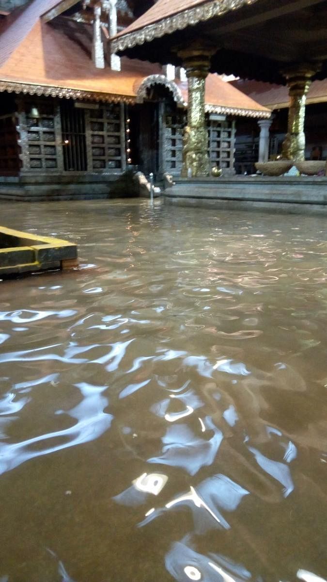 Water enters the courtyard of Sri Durgaparameshwari Temple at Bappanadu in Mulki on Sunday.