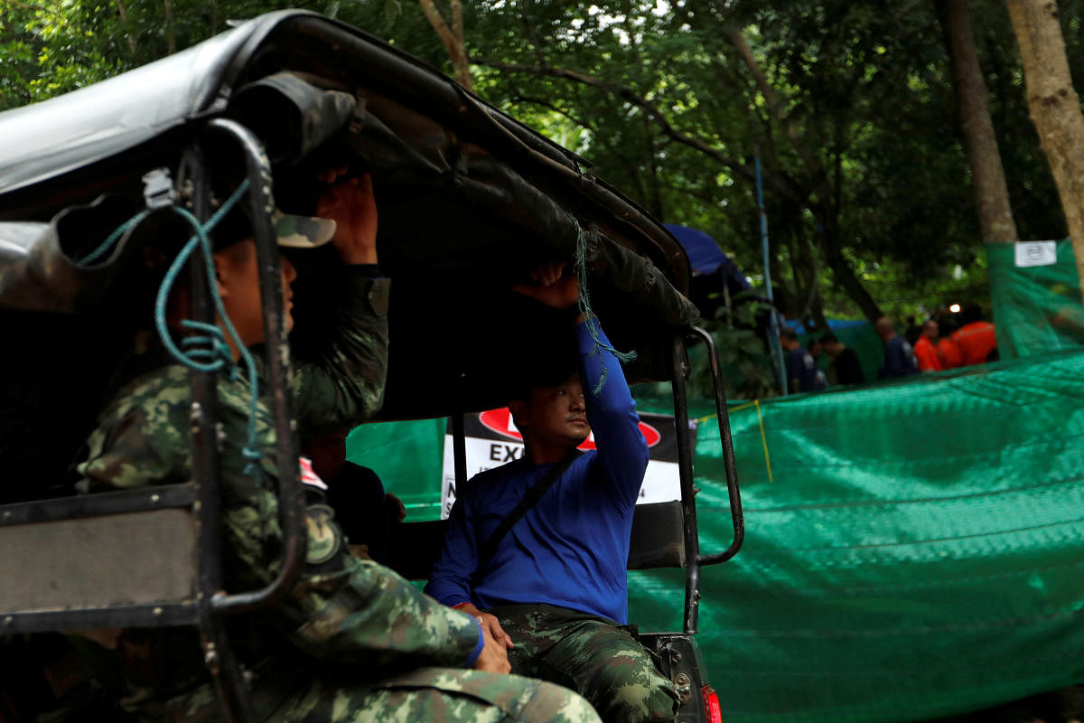 Soldiers arrive outside the Tham Luang cave complex after Thailand's government instructed members of the media to move out urgently, in the northern province of Chiang Rai. Reuters