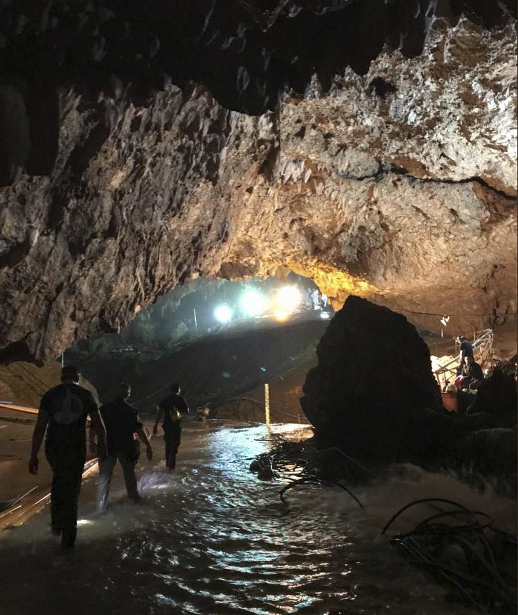 The image shows efforts underway to rescue trapped members of a youth soccer team from a flooded cave in northern Thailand. AP/PTI Photo