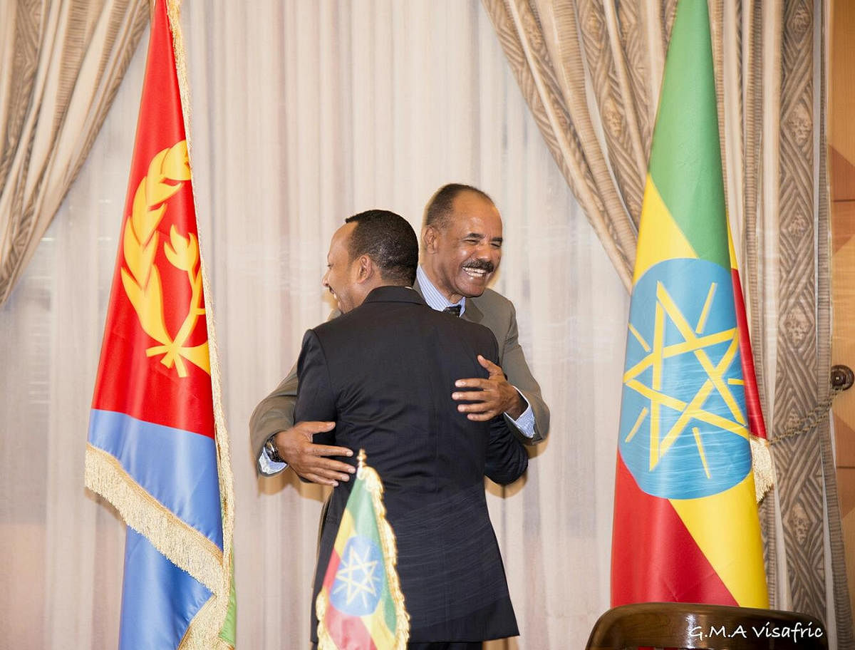 Ethiopia's Prime Minister Abiy Ahmed and Eritrean President Isaias Afwerk embrace at the declaration signing in Asmara, Eritrea July 9, 2018 in this photo obtained from social media on July 10, 2018. (GHIDEON MUSA ARON VISAFRIC/via REUTERS)
