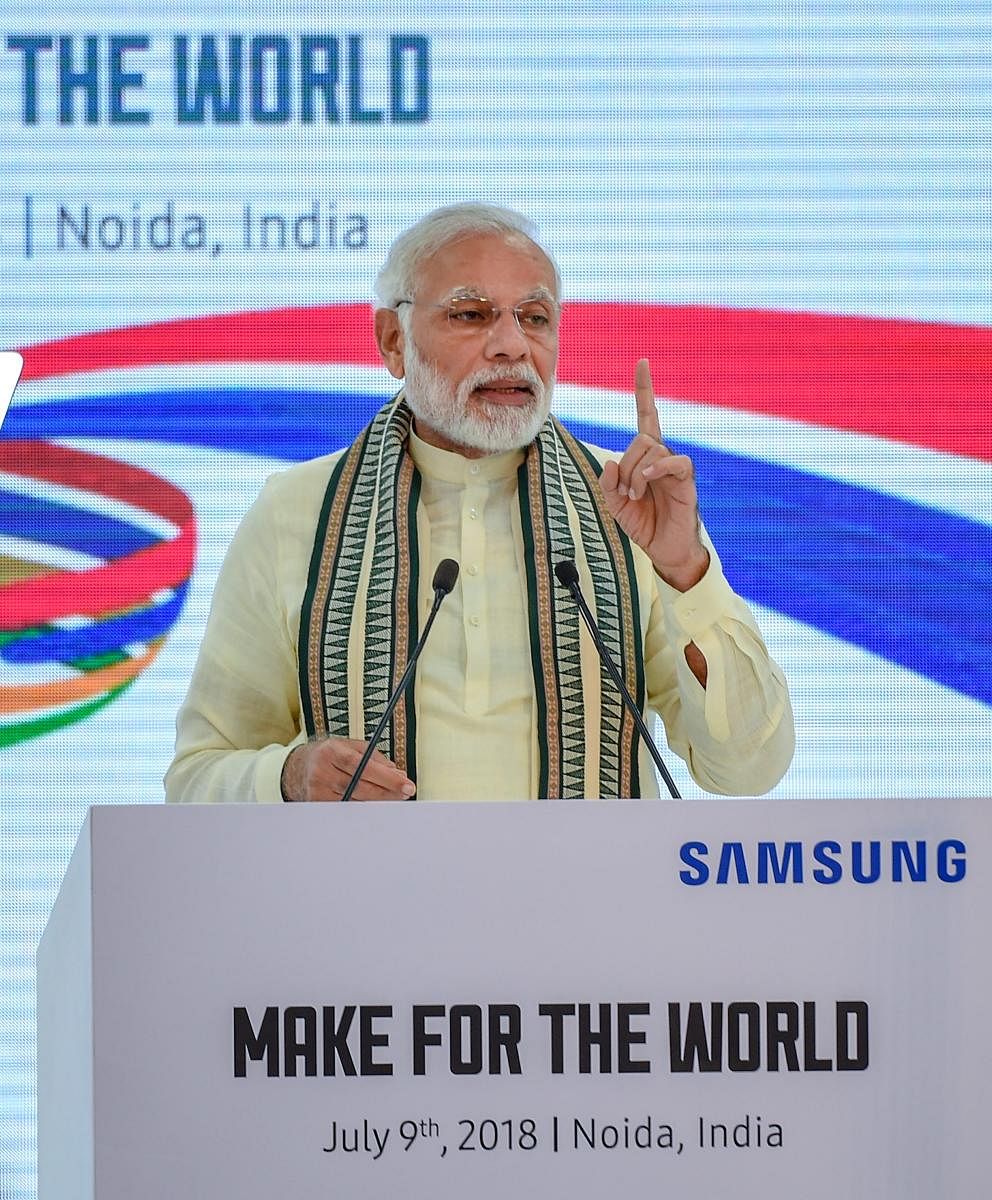Noida: Prime Minister Narendra Modi addresses at the inauguration ceremony of Samsung mobile factory, in Noida on Monday, July 9, 2018. (PTI Photo/Atul Yadav) (PTI7_9_2018_000149A)