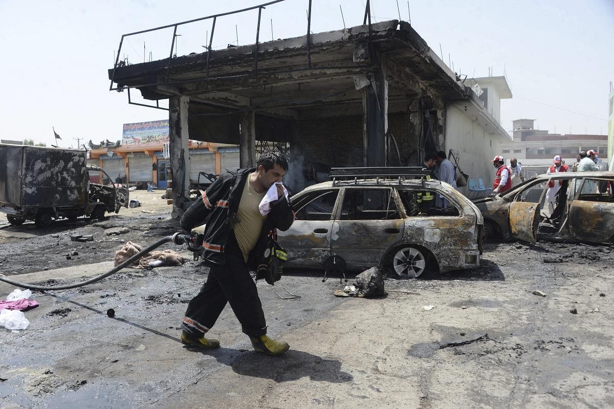  Firefighters work at the site of a deadly suicide attack in Jalalabad, the capital of Nangarhar province, Afghanistan, Tuesday, July 10, 2018. (AP/ PTI)
