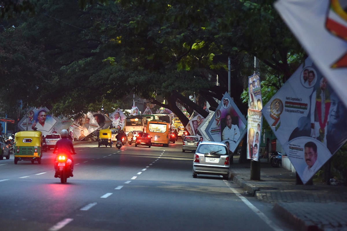 Illegal banners block walkers' way on Queen's Road
