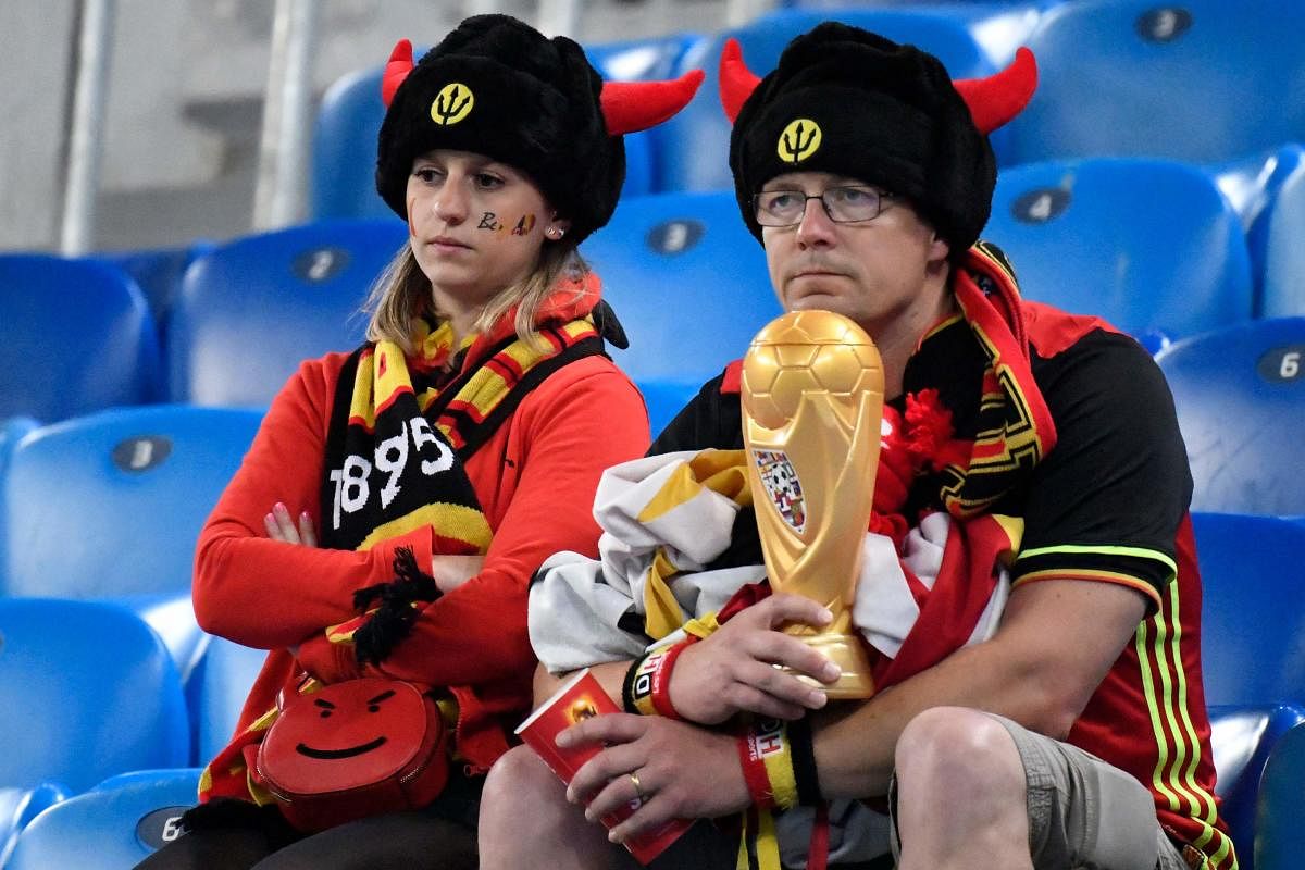 Belgium fans react to their team's defeat after the Russia 2018 World Cup semi-final between France and Belgium at the Saint Petersburg Stadium. (AFP Photo)