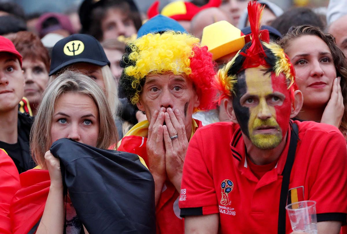 Belgium fans react as they watch the broadcast of the World Cup semi-final match between France and Belgium in the fan zone. (REUTERS/Yves Herman)