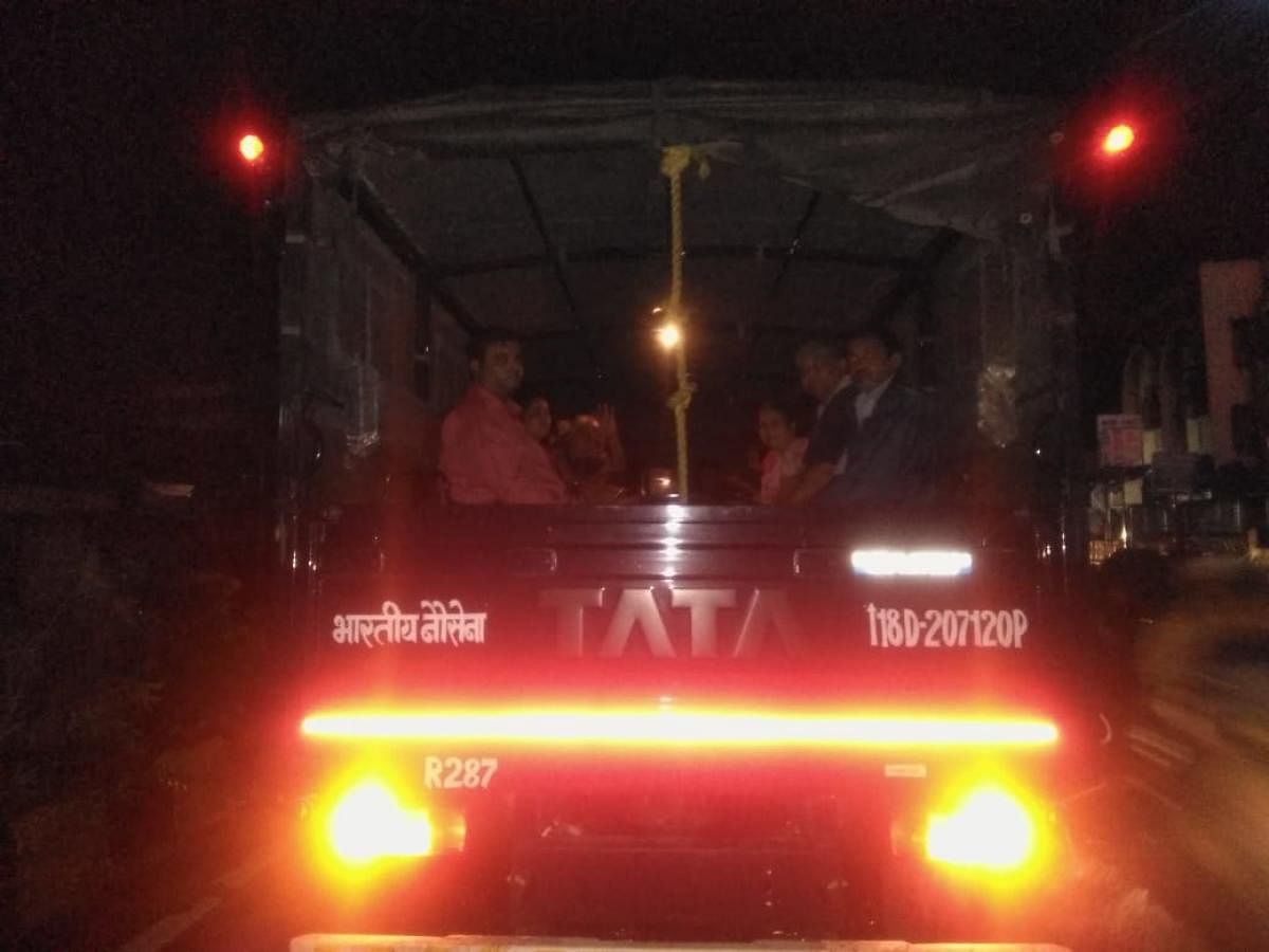Train travellers in a truck after Army helped their evacuation due to rain in Mumbai. (DH Photo)