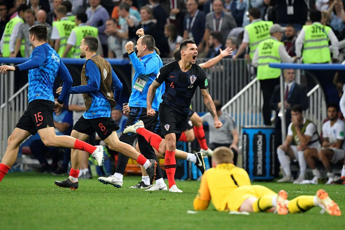 Croatia's players celebrate their victory at the end of the Russia 2018 World Cup semi-final football match between Croatia and England at the Luzhniki Stadium in Moscow on July 11, 2018. / AFP PHOTO /