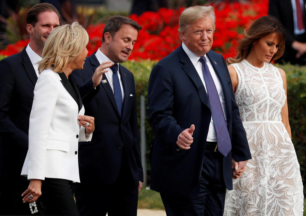 President Donald Trump with U.S. first lady Melania Trump, Luxembourg's Prime Minister Xavier Bettel with his spouse Gauthier Destenay and France's first lady Brigitte Macron walk during the NATO Summit. Reuters photo.