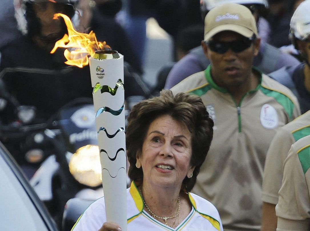 Former No. 1-ranked tennis player Maria Esther Bueno carries the Rio 2016 Olympic torch during the torch relay in Sao Paulo, Brazil. AP/PTI file photo.