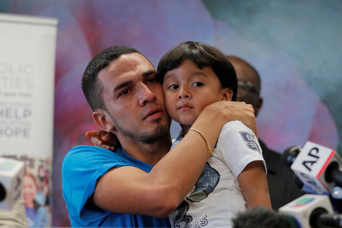 Javier, a 30 year old from Honduras, holds his 4 year old son William during a media availability in New York after they were reunited after being separated for 55 days following their detention at the Texas border, US. Reuters Photo